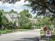 Quiet street view featuring well-maintained lawns, mature trees, and charming homes in a golf cart friendly community at 4532 Girvan Dr. # A, Myrtle Beach, SC 29579