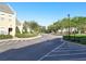 Well-maintained street view with landscaped lawns and community signage at 4532 Girvan Dr. # A, Myrtle Beach, SC 29579
