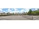 Well-maintained tennis courts provide recreational opportunity, with residential buildings in the background at 4532 Girvan Dr. # A, Myrtle Beach, SC 29579