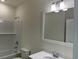 Bright bathroom featuring a white vanity, modern fixtures, and a subway-tiled shower-tub combo at 4750 N Huckleberry Ln., Conway, SC 29526