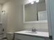 Bathroom showcasing a modern single sink vanity, framed mirror, and shower-tub combo at 4750 N Huckleberry Ln., Conway, SC 29526