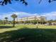 Modern commercial building with ample parking, surrounded by green lawns and palm trees for a professional setting at 4750 N Huckleberry Ln., Conway, SC 29526
