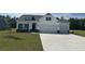 Charming two-story home with a well-manicured lawn, two-car garage and stone accents at 4750 N Huckleberry Ln., Conway, SC 29526