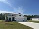 Beautiful two-story home with a two-car garage, a well-manicured lawn, and ample parking at 4750 N Huckleberry Ln., Conway, SC 29526
