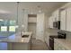 Modern kitchen featuring an island with quartz countertop, stainless steel appliances and designer backsplash at 4750 N Huckleberry Ln., Conway, SC 29526