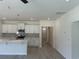Bright kitchen featuring white cabinets, stainless steel appliances and an island at 4750 N Huckleberry Ln., Conway, SC 29526