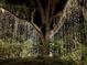 Enchanting outdoor display featuring a tree adorned with countless twinkling lights for a magical nighttime ambiance at 4750 N Huckleberry Ln., Conway, SC 29526
