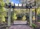 Relaxing outdoor swing with a view of a serene pond, perfect for enjoying peaceful moments in nature at 4750 N Huckleberry Ln., Conway, SC 29526