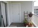 Cozy balcony featuring sliding glass doors, white railings, and potted plants for a relaxing outdoor space at 500 Wickham Dr. # 1070, Myrtle Beach, SC 29579