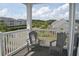 Enjoy the outdoors on this balcony with seating and views of the neighborhood and trees at 500 Wickham Dr. # 1070, Myrtle Beach, SC 29579