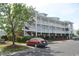 Beautiful exterior of a multi-story condo with parking in front of the building at 500 Wickham Dr. # 1070, Myrtle Beach, SC 29579