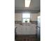 Bright kitchen with white cabinets, mosaic backsplash, and stainless steel appliances at 500 Wickham Dr. # 1070, Myrtle Beach, SC 29579