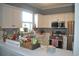 Updated kitchen with white cabinets, stainless steel appliances and view into the living room at 500 Wickham Dr. # 1070, Myrtle Beach, SC 29579