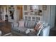 Cozy living room features a plush gray sofa and a decorative white cabinet at 500 Wickham Dr. # 1070, Myrtle Beach, SC 29579