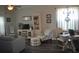 Inviting living room with a TV, bookshelf, and a cozy seating area at 500 Wickham Dr. # 1070, Myrtle Beach, SC 29579