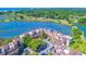 Aerial view of condo complex with mature trees, lake, and golf course in the background at 501 Maison Dr. # F8, Myrtle Beach, SC 29572
