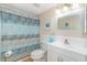 Bathroom features a shower with a curtain, a toilet and a vanity with a mirror at 501 Maison Dr. # F8, Myrtle Beach, SC 29572