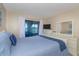 Inviting bedroom with a comfortable bed, dresser, and a view of the water at 501 Maison Dr. # F8, Myrtle Beach, SC 29572