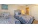 Charming bedroom with two beds, complemented by serene decor and access to a bathroom at 501 Maison Dr. # F8, Myrtle Beach, SC 29572