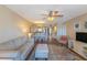 Inviting living room and dining area with hardwood floors and plenty of natural light at 501 Maison Dr. # F8, Myrtle Beach, SC 29572