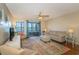 Comfortable living room is furnished with a sofa, side chairs and sliding door access to the balcony at 501 Maison Dr. # F8, Myrtle Beach, SC 29572