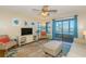 Well-lit living room showcases a comfortable seating arrangement and access to the private balcony at 501 Maison Dr. # F8, Myrtle Beach, SC 29572