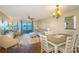 Open living space integrates a living room and dining area under a shared ceiling fan at 501 Maison Dr. # F8, Myrtle Beach, SC 29572