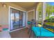 This porch is furnished with comfy seating and offers relaxing lake views at 501 Maison Dr. # F8, Myrtle Beach, SC 29572