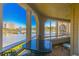 Enjoy the stunning water views from the screened porch with seating and table at 501 Maison Dr. # F8, Myrtle Beach, SC 29572