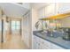 A convenient wet bar with sink and storage enhances this home's entertainment possibilities at 501 Maison Dr. # F8, Myrtle Beach, SC 29572