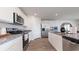Bright kitchen featuring stainless steel appliances, granite countertops, and white cabinets at 520 Scarlet Sage Dr., Conway, SC 29527