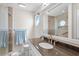 Modern bathroom features granite vanity top and glass-enclosed tiled shower at 527 Bay Drive Ext., Garden City Beach, SC 29576