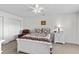 Comfortable bedroom featuring neutral walls, carpet, ceiling fan, and white-painted furniture and closet doors at 527 Bay Drive Ext., Garden City Beach, SC 29576