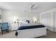 Spacious bedroom with a ceiling fan, carpeting and bright natural light at 527 Bay Drive Ext., Garden City Beach, SC 29576