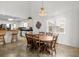 Cozy dining area with a wooden table, adjacent to the kitchen and bathed in natural light at 527 Bay Drive Ext., Garden City Beach, SC 29576