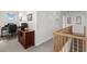 Upstairs hallway with desk and office setup adjacent to staircase and landing at 527 Bay Drive Ext., Garden City Beach, SC 29576