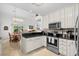 Open kitchen with stainless steel appliances and easy access to the dining area at 527 Bay Drive Ext., Garden City Beach, SC 29576