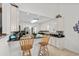 Well-lit kitchen featuring white cabinets, dark countertops, and a breakfast bar with seating at 527 Bay Drive Ext., Garden City Beach, SC 29576