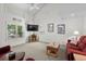 Spacious living room with a vaulted ceiling, large windows, and comfortable furniture for relaxation at 527 Bay Drive Ext., Garden City Beach, SC 29576