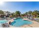 A resort-style pool area, surrounded by comfortable lounge chairs and manicured landscaping at 527 Bay Drive Ext., Garden City Beach, SC 29576