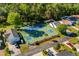 Overhead view of a well-maintained community tennis court surrounded by lush greenery at 527 Bay Drive Ext., Garden City Beach, SC 29576
