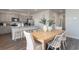 Bright eat-in kitchen features modern appliances, grey cabinets, and an island with bar stool seating at 528 Scarlet Sage Dr., Conway, SC 29527