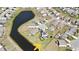 Aerial view of a residential community with a pond, homes and manicured lawns at 5809 Oakbury Ct., Myrtle Beach, SC 29579