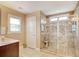 Bright bathroom features large tiled glass shower, decorative tile accents, and a wooden bench at 5809 Oakbury Ct., Myrtle Beach, SC 29579