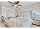 This bedroom has a patterned grey wall with an upholstered bed and desk at 5809 Oakbury Ct., Myrtle Beach, SC 29579