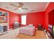 A red themed bedroom with arcade game and keyboard at 5809 Oakbury Ct., Myrtle Beach, SC 29579