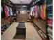 This walk-in closet features custom built-ins, bench seating, and ample space for storage at 5809 Oakbury Ct., Myrtle Beach, SC 29579