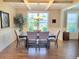 Comfortable dining room with neutral colors, natural light, and a stylish chandelier at 5809 Oakbury Ct., Myrtle Beach, SC 29579