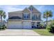 Inviting two-story home with a three-car garage, manicured lawn and lovely landscaping at 5809 Oakbury Ct., Myrtle Beach, SC 29579
