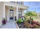 Inviting front porch with tasteful landscaping, offering a cozy seating area and welcoming entrance at 5809 Oakbury Ct., Myrtle Beach, SC 29579